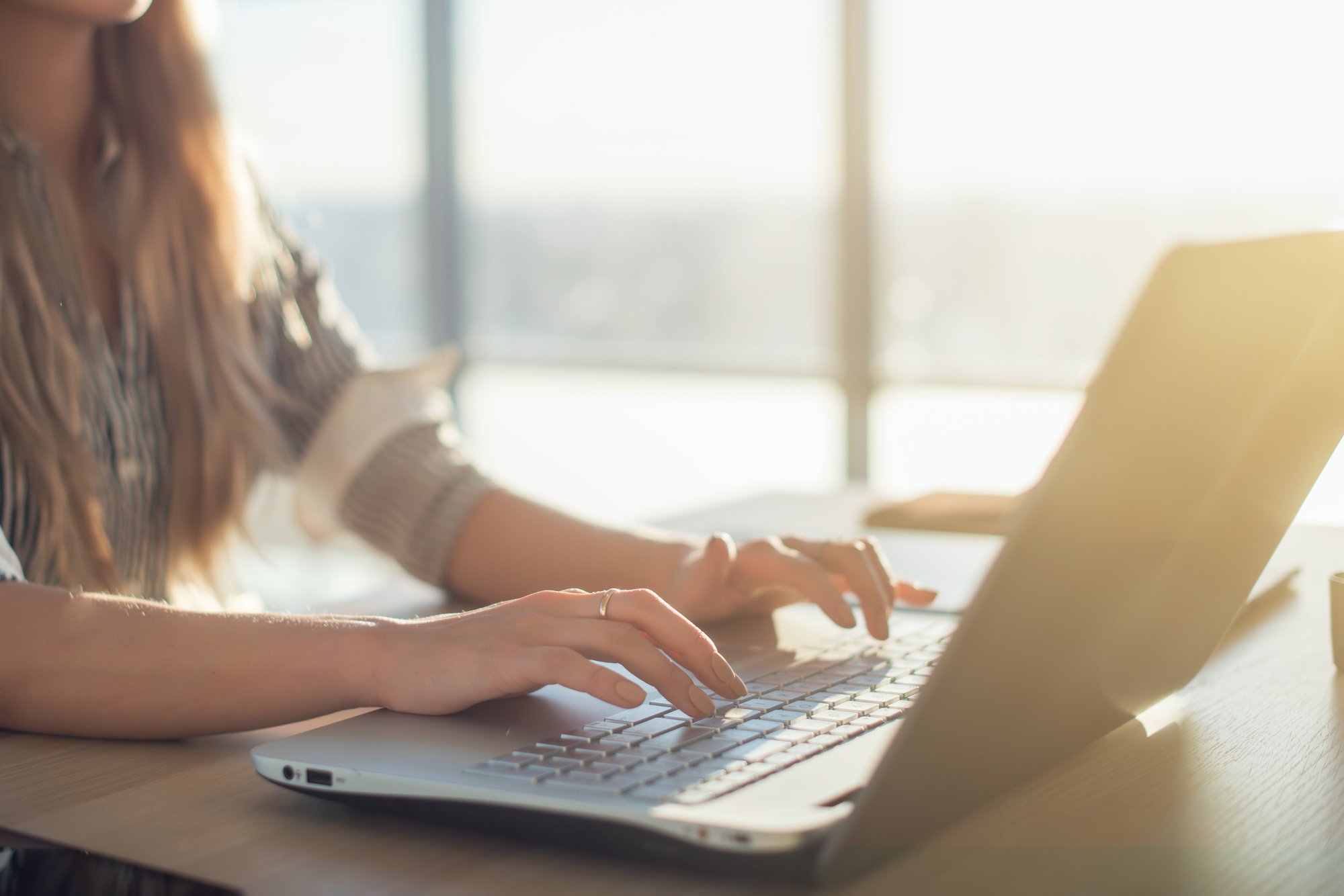 Person Typing on a Laptop